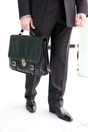 Businessman holding a briefcaseの写真素材