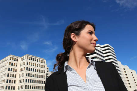 Low-angle shot of a businesswoman standing outsideの写真素材