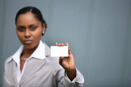 Businesswoman with a blank cardの写真素材