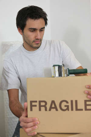 Man packing boxesの写真素材