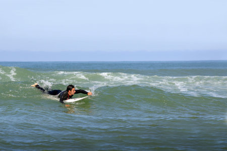 Surfer paddling