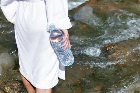 woman walking in a riverの写真素材