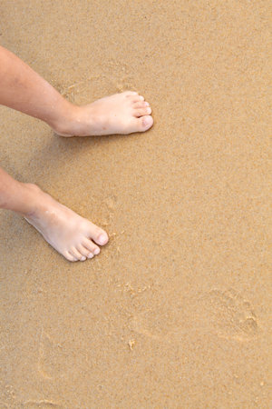 Bare feet on a sandy beach