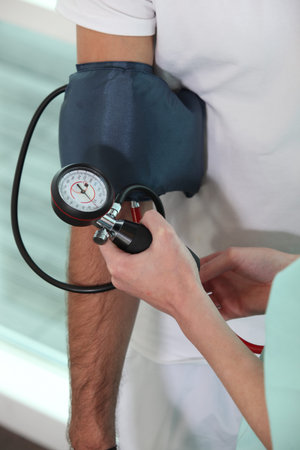 Nurse taking blood pressure