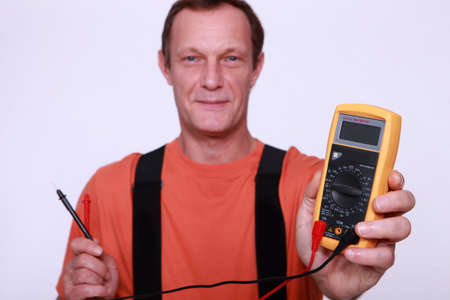 Man holding voltmeterの写真素材