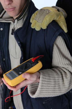 Electrician with a voltmeterの写真素材