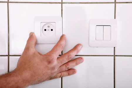 Man fitting a continental wall socket