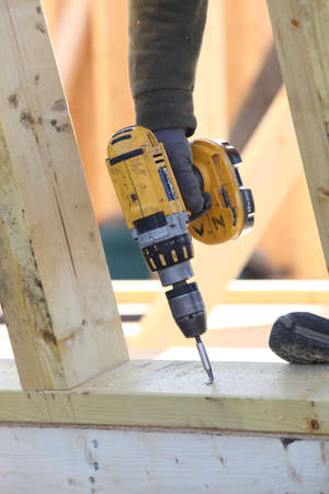 Man using a cordless screwdriverの写真素材