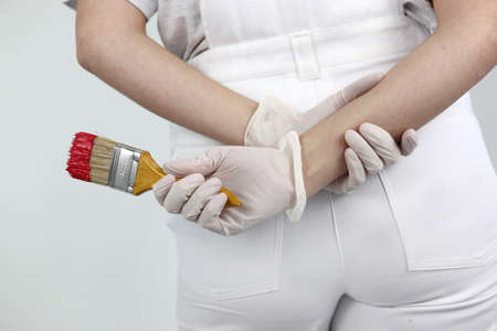 Female decorator holding a paint brushの写真素材