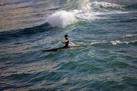 Man canoing in the seaの写真素材