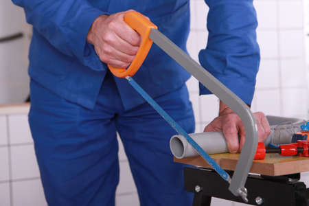 Plumber with a sawの写真素材