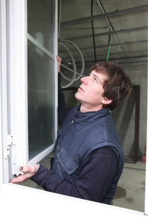 Man hanging a window