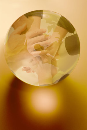 Hands around a globe