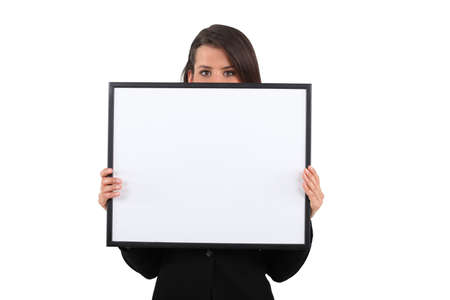 girl behind white frameの写真素材