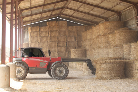 Tractor storing bails of hay