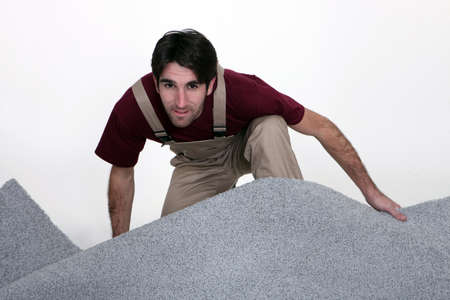 craftsman laying wall-to-wall carpetの写真素材