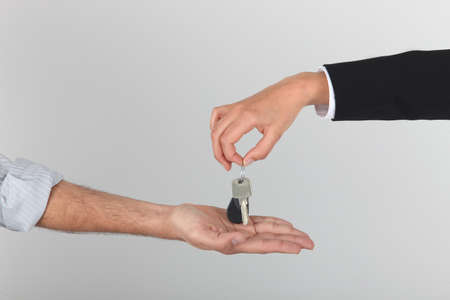 Agent handing over keysの写真素材