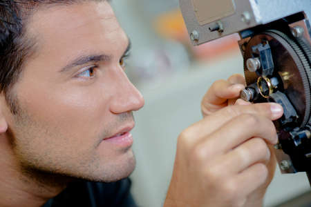 Jeweller making adjustments\' to a ringの写真素材