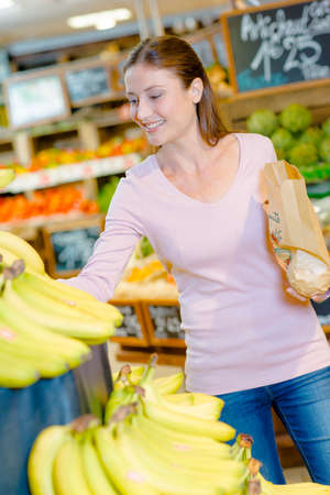 Consumer buying fruitの写真素材