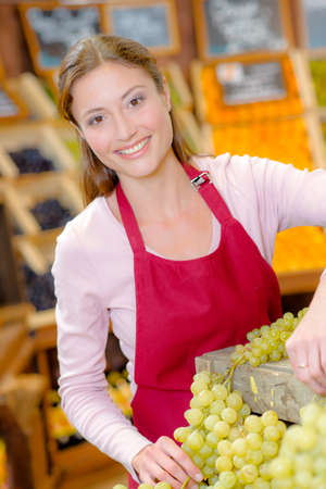 Female fruit stall workerの写真素材