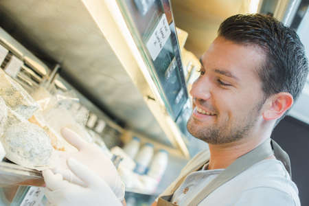 Gloved man at cold counterの写真素材