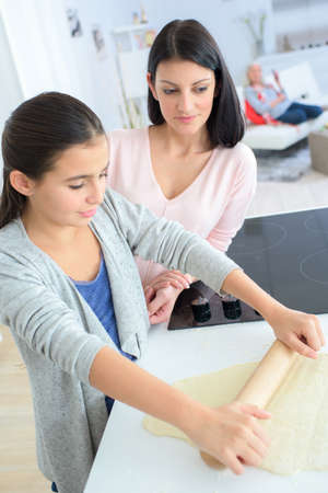 Mother and daughter bakingの写真素材