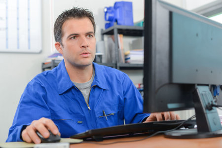 Builder at his desk