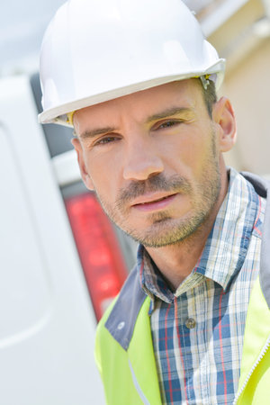 Builder wearing high visibility vest