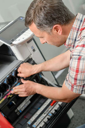 Repairing photocopierの写真素材