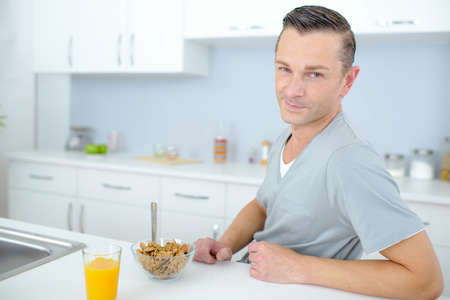 Man having his breakfastの写真素材