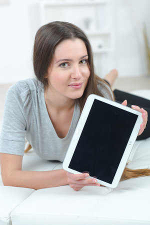 Woman using her tablet computer