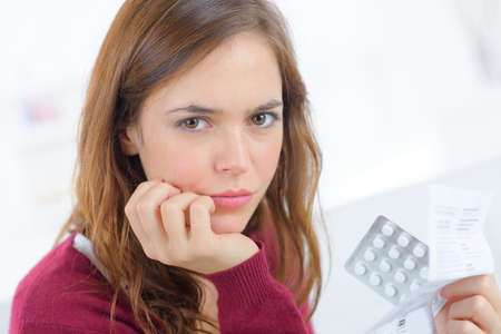 Worried about taking the pillの写真素材