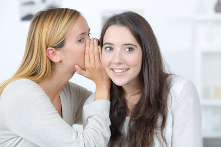 Whispering a secret to a friend