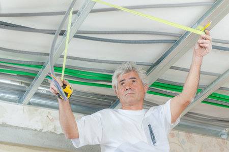 Measuring the ceilingの写真素材