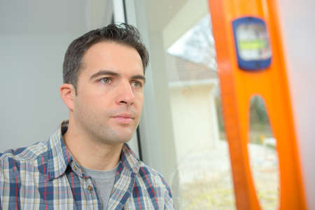 Checking the wall is straightの写真素材