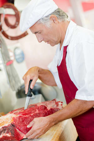 Butcher cutting up meatの写真素材