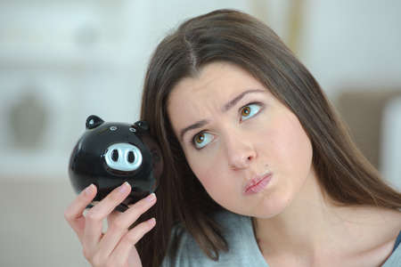 Lady with piggy bankの写真素材