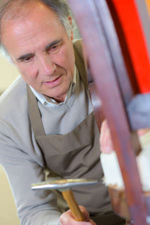 Repairing a chairの写真素材