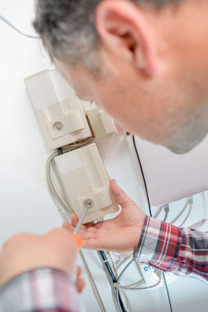 Repairing a fuseboxの写真素材