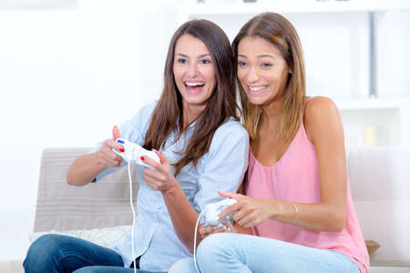 Two women playing video gamesの写真素材