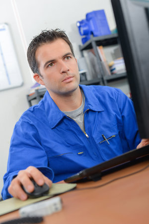 Artisan at his desk