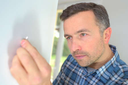 Assembling a kitchen unitの写真素材