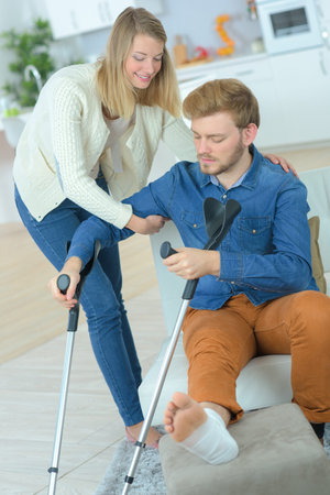 Woman helping her injured boyfriend