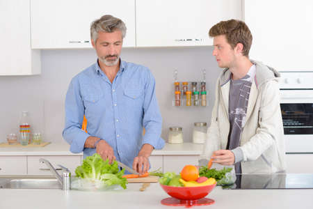 men preparing lunchの写真素材