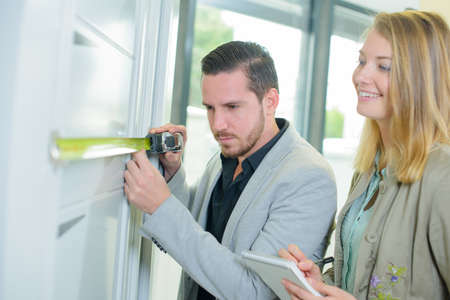 measuring a wallの写真素材