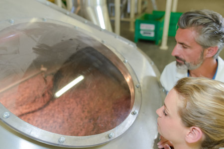 looking at a coffee grinderの写真素材