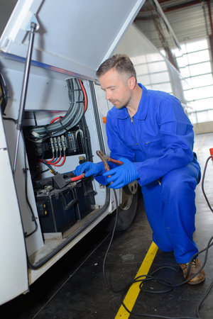 fixing a big vehicleの写真素材