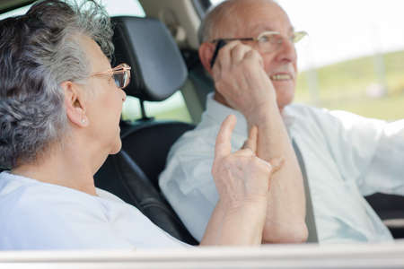 elderly couple in the carの写真素材