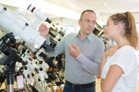 man selling telescopesの写真素材