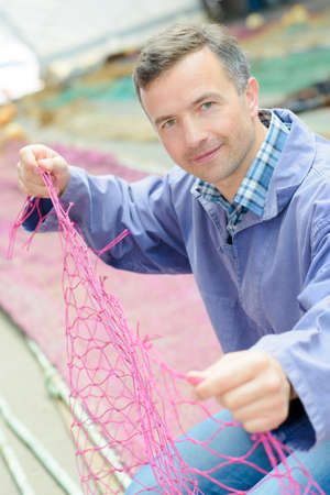 man holding a netの写真素材